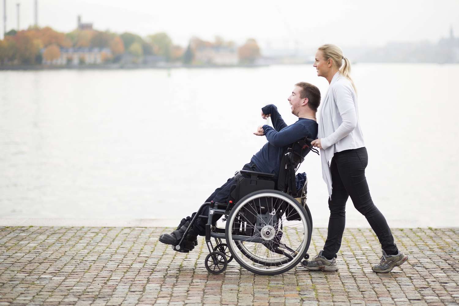 Caregiver supporting an adult in a warm care setting